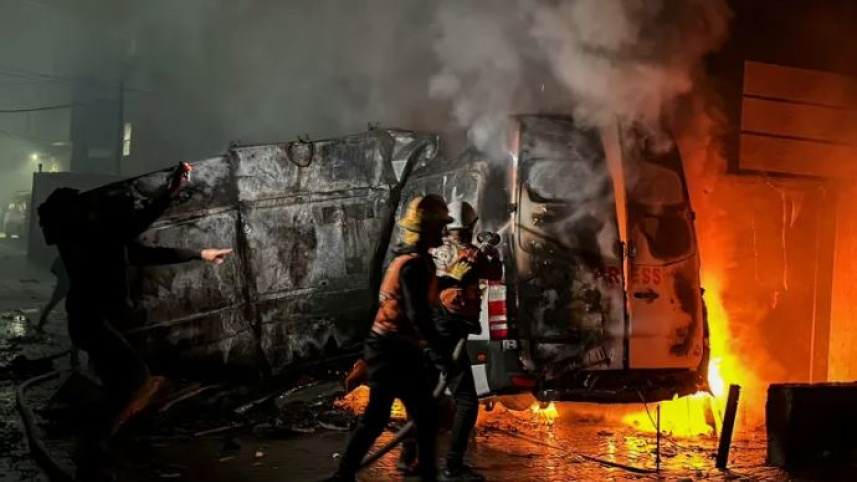 বিমান হামলার পর ভ্যানের আগুন নেভানোর চেষ্টা চলছে। ছবি: রয়টার্স