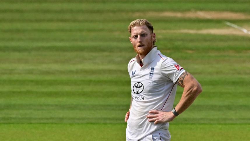 England's captain Ben Stokes (R) reacts 