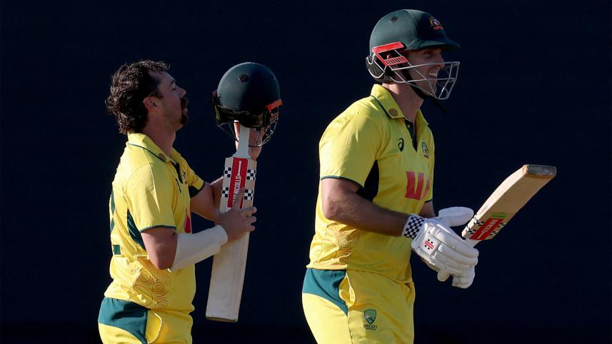Australia’s Travis Head (L) reacts as he celebrates after reaching his century with team mate and captain Mitchell Marsh 