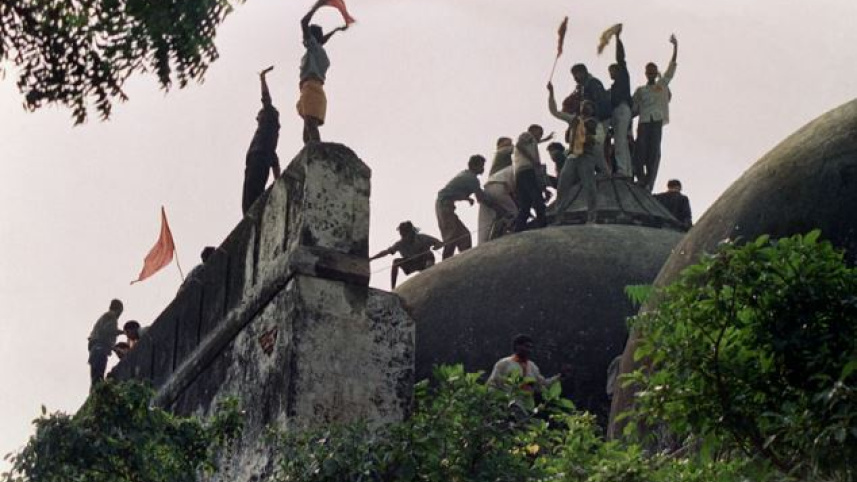 youth_atop_babri_mosque_afp.jpg