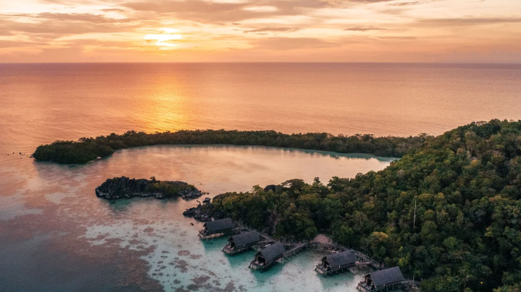 aerial-overwater-suite-sunset-with-setigi-reef-background