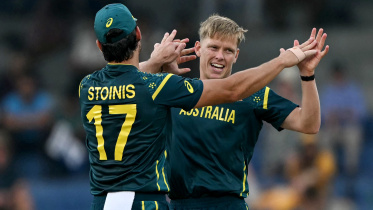 Australia's Nathan Ellis (R) celebrates with teammate Marcus Stoinis 