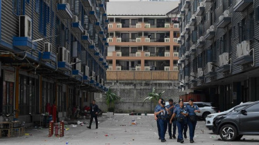 ম্যানিলার এই ভবন থেকে ১ হাজার পাচার হওয়া মানুষকে উদ্ধার করেছে পুলিশ। ছবি: এএফপি