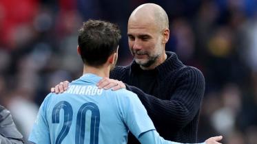 Pep Guardiola celebrates with Bernardo Silva