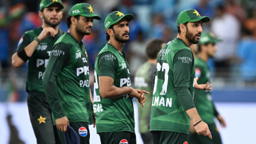 Pakistan's players walk back to the pavilion at the end of the Asia Cup 2025 Twenty20 international cricket match against India at the Dubai International Stadium